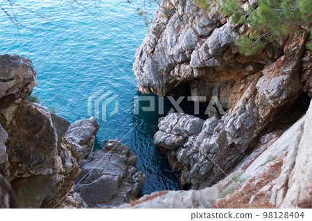 Top view of beautiful blue sea surface and fantastic rocky coast, Montenegro Top view of beautiful blue sea surface and fantastic rocky coast, Montenegro 98128404