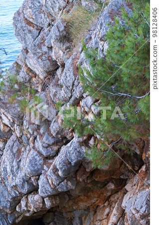 Top view of beautiful blue sea surface and fantastic rocky coast, Montenegro Top view of beautiful blue sea surface and fantastic rocky coast, Montenegro 98128406