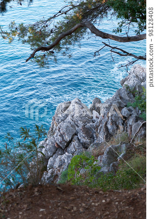 Top view of beautiful blue sea surface and fantastic rocky coast, Montenegro Top view of beautiful blue sea surface and fantastic rocky coast, Montenegro 98128408