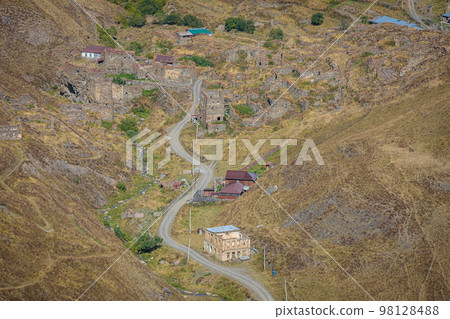 Old ruined city in the mountains of North Ossetia. Old ruined city in the mountains of North Ossetia. 98128488