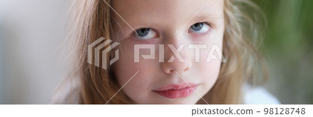 Portrait of pensive serious little child girl looks up 98128748