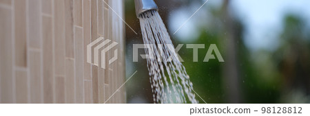 Detail of outdoor water shower on beach closeup Detail of outdoor water shower on beach closeup 98128812