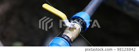 Closeup of pvc pipes with tap or faucet Closeup of pvc pipes with tap or faucet 98128842
