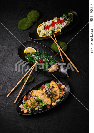 Three different kind of salad salad on a black concrete background 98129839