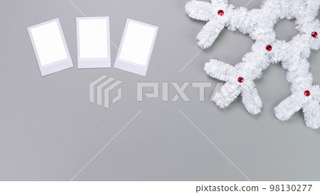 Polaroid retro photo frames isolated on grey background. Real photo template. Three frames. Mockup. Christmas white fluffy snowflake. Winter decoration. Polaroid retro photo frames isolated on grey background. Real photo template. Three frames. Mockup. Christmas white fluffy snowflake. Winter decoration. 98130277