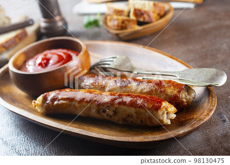 Sausages fried with spices and herbs, Selective focus Sausages fried with spices and herbs, Selective focus 98130475