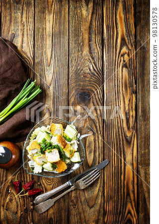 Fish dish - fried fish fillet with vegetables on glass plate 98130578