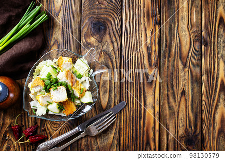 Fish dish - fried fish fillet with vegetables on glass plate 98130579
