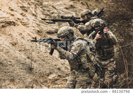 Group of soldiers with rifles before combat Group of soldiers with rifles before combat 98130798
