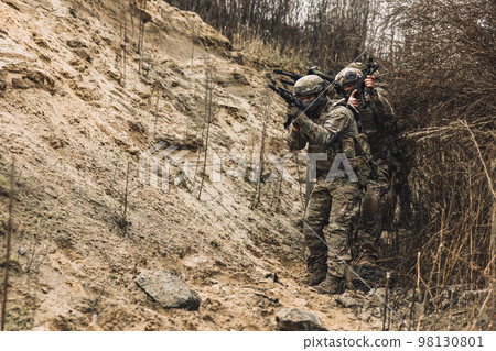 Group of soldiers with rifles before combat Group of soldiers with rifles before combat 98130801