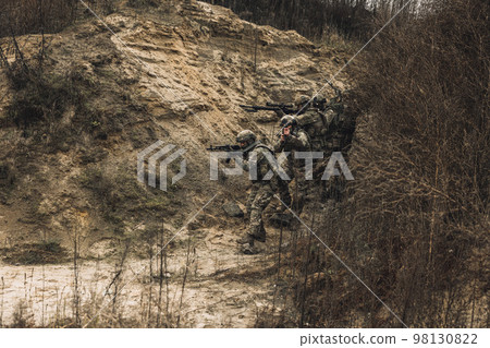 Group of soldiers with rifles before combat 98130822