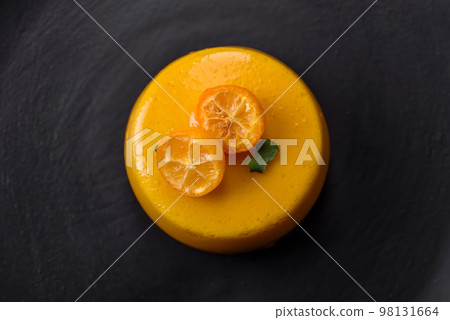 Delicious fresh tartlet with citrus filling and decorated with passion fruit Delicious fresh tartlet with citrus filling and decorated with passion fruit 98131664