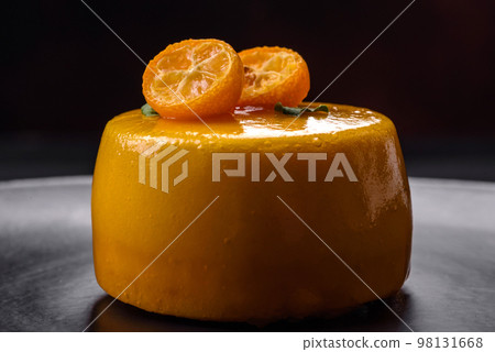 Delicious fresh tartlet with citrus filling and decorated with passion fruit Delicious fresh tartlet with citrus filling and decorated with passion fruit 98131668