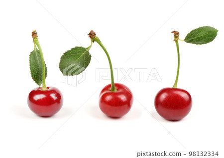 Collection of cherries with green leaf isolated on white background, side view. Extrem close-up. Collection of cherries with green leaf isolated on white background, side view. Extrem close-up. 98132334