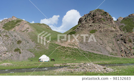 Traditional Yurt tent in Kyrgyzstan countryside. Yurt tents are traditional, portable tents made of felt that are used as a form of accommodation in the country. 98132683