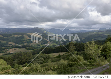 A Rustic mountain landscape with cloudy sky A Rustic mountain landscape with cloudy sky 98132731