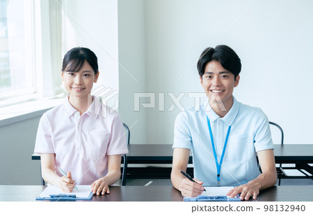 Young men and women undergoing training 98132940