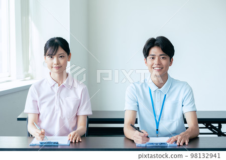 Young men and women undergoing training 98132941