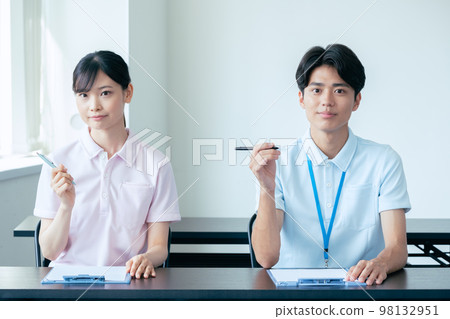 Young men and women undergoing training 98132951