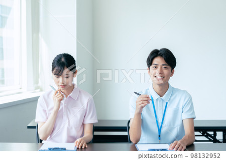 Young men and women undergoing training 98132952