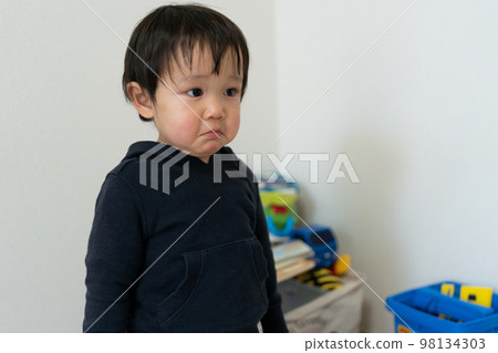 boy with sad expression 98134303