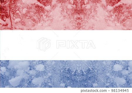 Defocus cold winter in Netherlands. The concept of the energy crisis and the increasing demand for electricity. Holland flag snow holiday. Out of focus 98134945