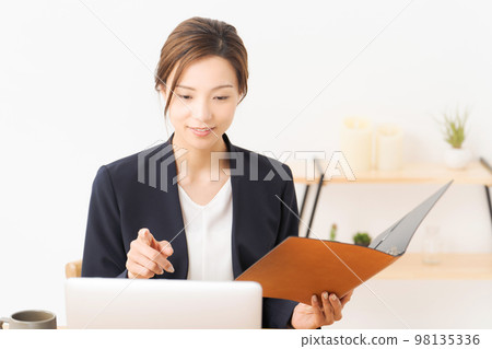 woman working in a suit woman working in a suit 98135336