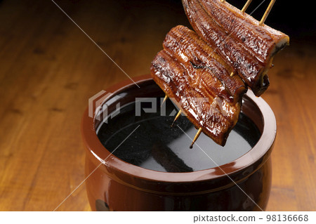 Grilled eel marinated in a secret sauce 98136668