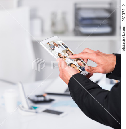 Video conference on smartphone or tablet, business meeting. Communication with business colleagues via video conference closeup Video conference on smartphone or tablet, business meeting. Communication with business colleagues via video conference closeup 98137340