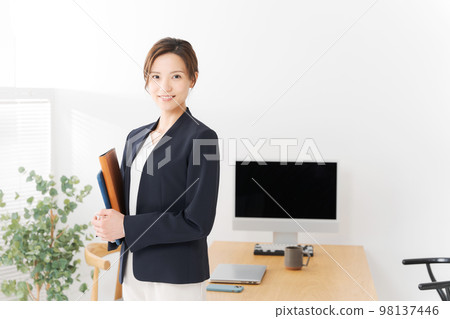 Woman working in the office Woman working in the office 98137446