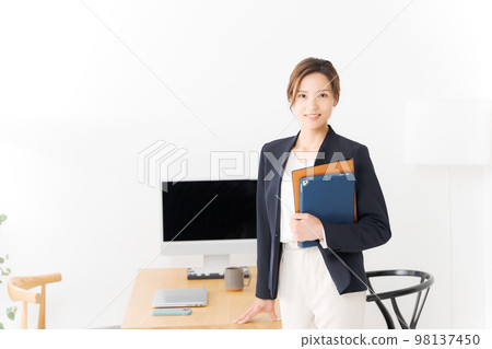 Woman working in the office Woman working in the office 98137450
