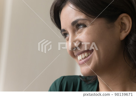 Cheerful dreamy young Asian woman close up face portrait 98139671