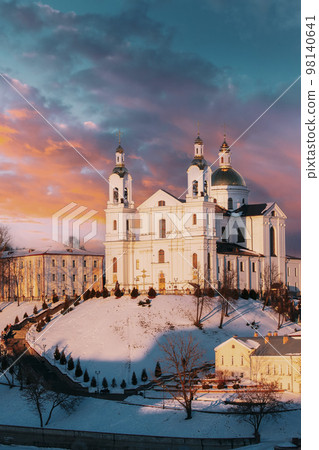 Vitebsk, Belarus. Vertical Morning View Of Famous Landmark Is Assumption Cathedral Church In Upper Town On Uspensky Mount Hill In Sunrise Illumination. Soft Colors Vitebsk, Belarus. Vertical Morning View Of Famous Landmark Is Assumption Cathedral Church In Upper Town On Uspensky Mount Hill In Sunrise Illumination. Soft Colors 98140641