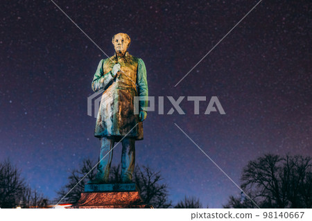 Colourful Night Starry Sky In Blue Colors. Helsinki, Finland. Close Up Of Statue Of Johan Ludvig Runeberg On Esplanadi Park In Lighting At Night Illumination. National Poet And Lyric Of Finland 98140667