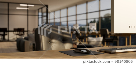 Modern office desk in modern office co-working space with wireless mouse, computer, and keyboard Modern office desk in modern office co-working space with wireless mouse, computer, and keyboard 98140806