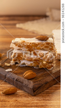 Almond turron dessert slices with nuts 98141288