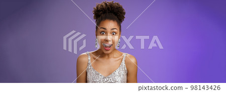 Close-up african-american impressed speechless young girl open mouth surprised gasping widen eyes astonished glancing impressed receive interesting amusing proposal, standing blue background 98143426