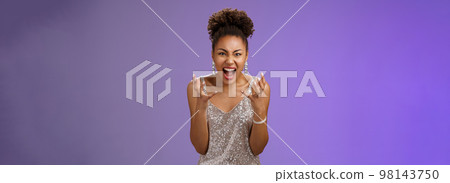 Annoyed bothered african american woman pissed freak-out shouting complaining fed up found out boyfriend cheating her b-day yelling crying clench fists outraged, standing blue background 98143750