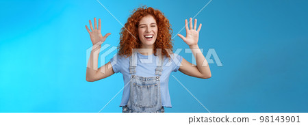 Fine you won. Cheerful carefree playful attractive redhead curly girlfriend having fun laughing out loud joyful raise hands up surrender fool around enjoy cool awesome time spending friend 98143901