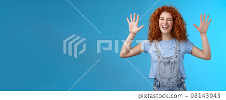 Fine you won. Cheerful carefree playful attractive redhead curly girlfriend having fun laughing out loud joyful raise hands up surrender fool around enjoy cool awesome time spending friend 98143943