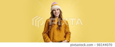 Outgoing stylish friendly-looking female employee tilting head smiling pleasant hold hands pockets jeans self-assured, expressing confidence determined reach success, yellow background Outgoing stylish friendly-looking female employee tilting head smiling pleasant hold hands pockets jeans self-assured, expressing confidence determined reach success, yellow background 98144070