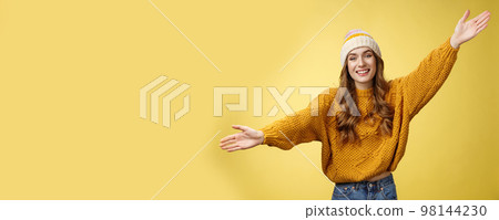 Friendly happy charming smiling cute girl inviting friends joyfully spread hands embracing wanna hug cuddle dear guest grinning cheerful, having fun expressing postivity good mood 98144230