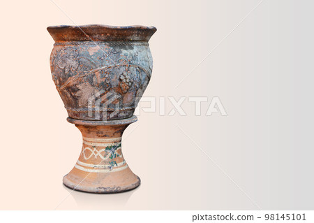 old and dirty brown and black clay pot is placed on a brown and black clay pedestal on pink background, object, decor, vintage, old, copy space 98145101