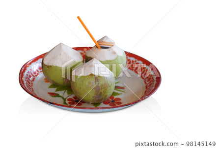three coconuts placed on white and red tray, on white background, nature, food, copy space 98145149