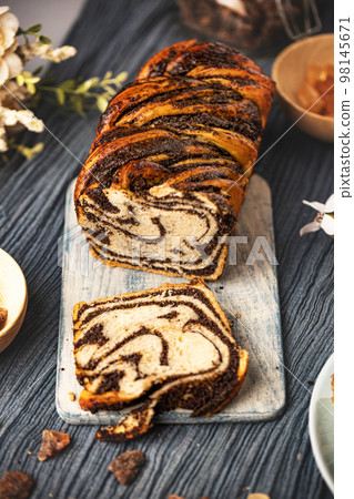 Poppy seeds swirl bread 98145671