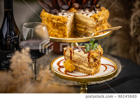 Slice of layered walnut cake Slice of layered walnut cake 98145680