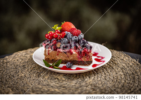 Portion of creamy fruit cake Portion of creamy fruit cake 98145741