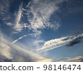 Mysterious cloud shape in the blue sky 98146474