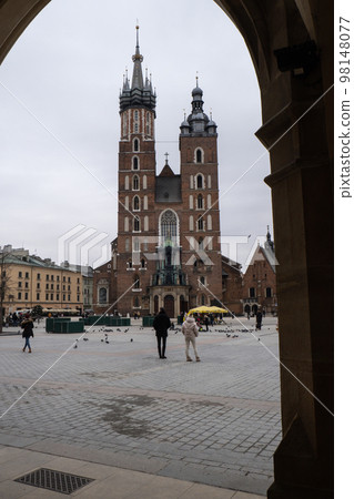 St. Mary's Basilica on the Krakow Main Square Rynek Glowny Poland. Krakow architecture, old city architecture. Historic church in Krakow Baroque architecture Travel tourist attraction St. Mary's Basilica on the Krakow Main Square Rynek Glowny Poland. Krakow architecture, old city architecture. Historic church in Krakow Baroque architecture Travel tourist attraction 98148077