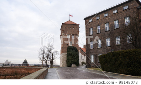 Royal Wawel royal castle in Krakow in rainy early spring weather in Poland. historic castle in the old city Gardens and cathedra, Cracow, Poland. Travel attraction 98148078